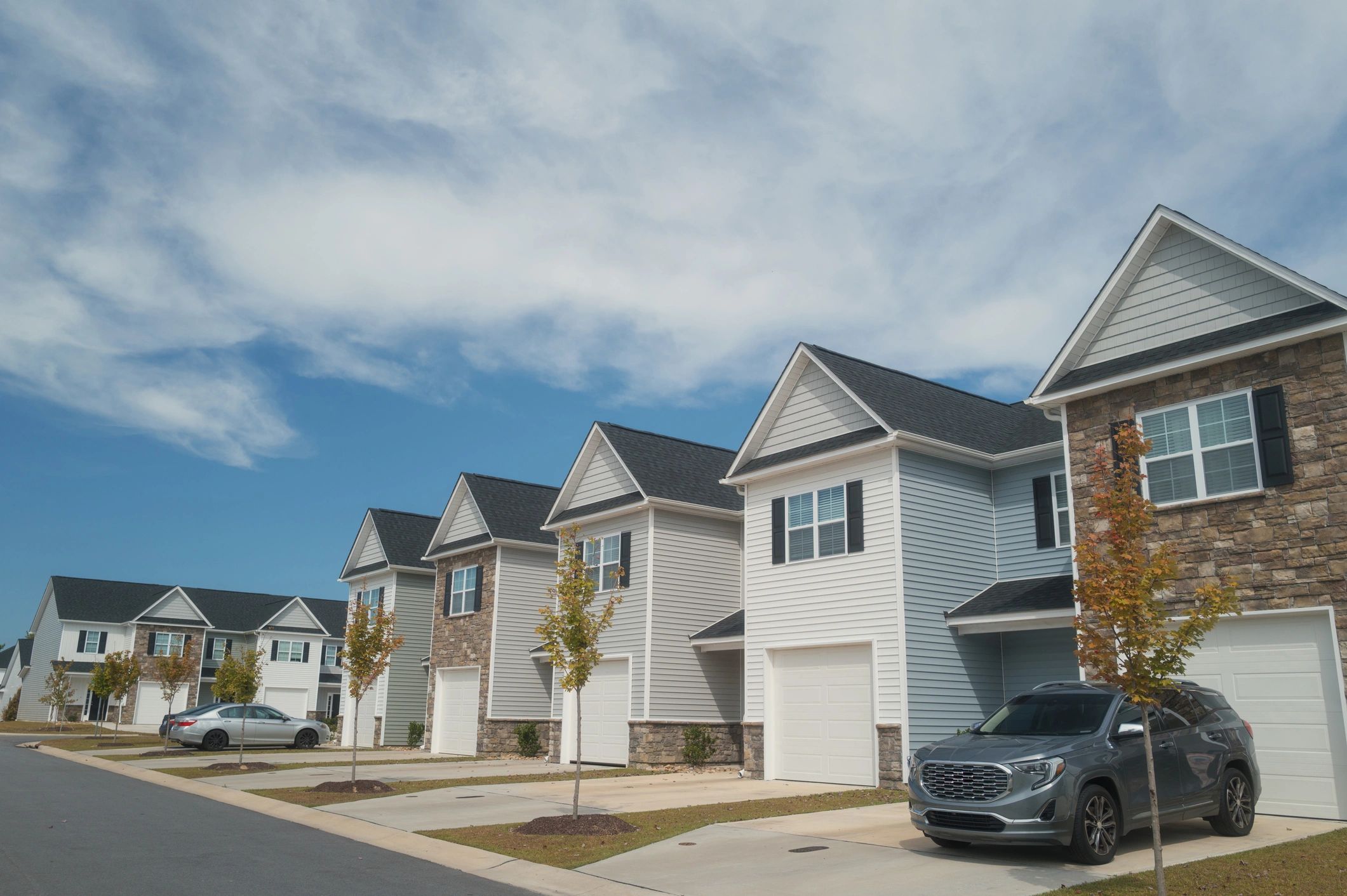 Residential townhomes under blue sky
