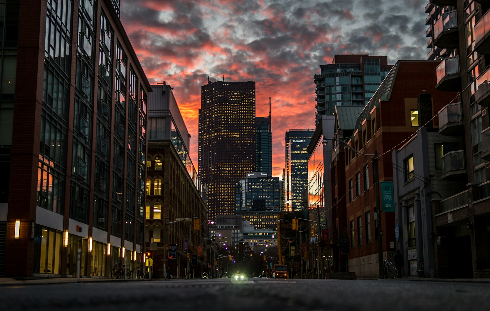 City development with commercial and residential buildings at sunset
