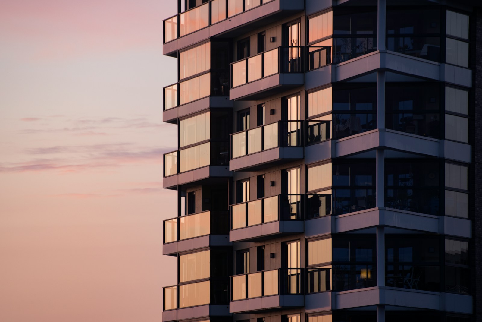 Modern multifamily apartment building at dusk